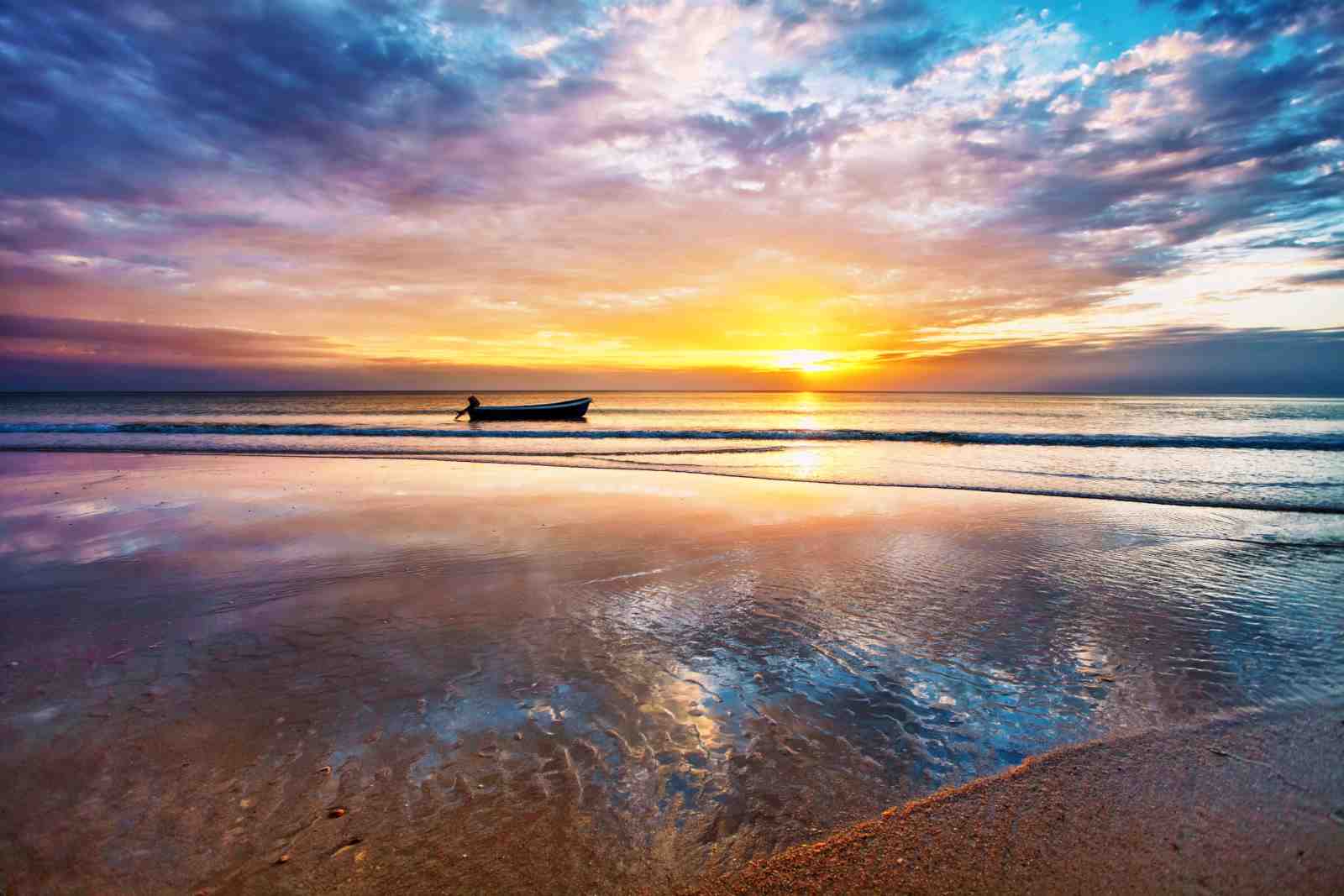 Serene Sunset Beach Boat Wall Art