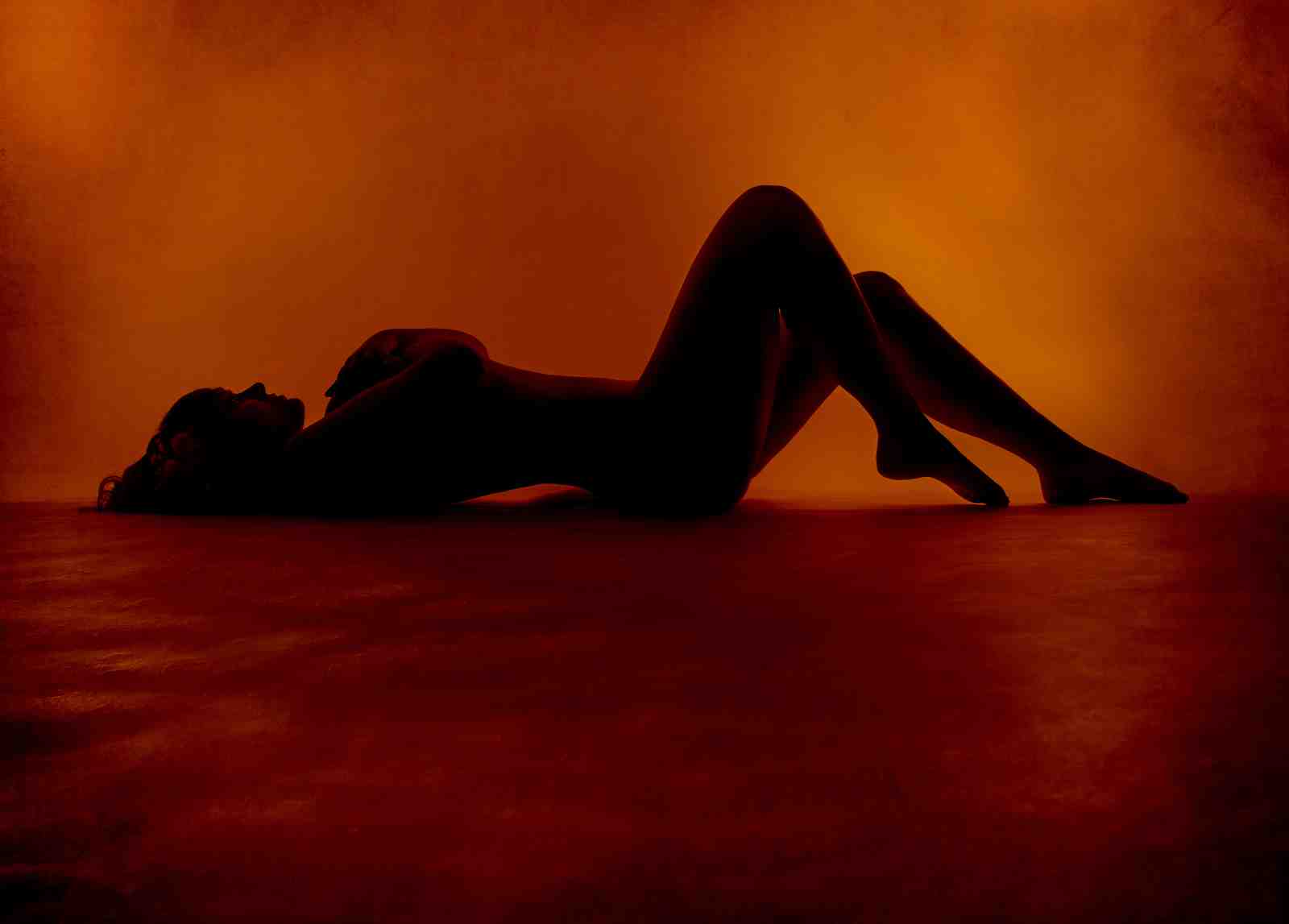 Serene Silhouette Woman Orange Glow Wall Art