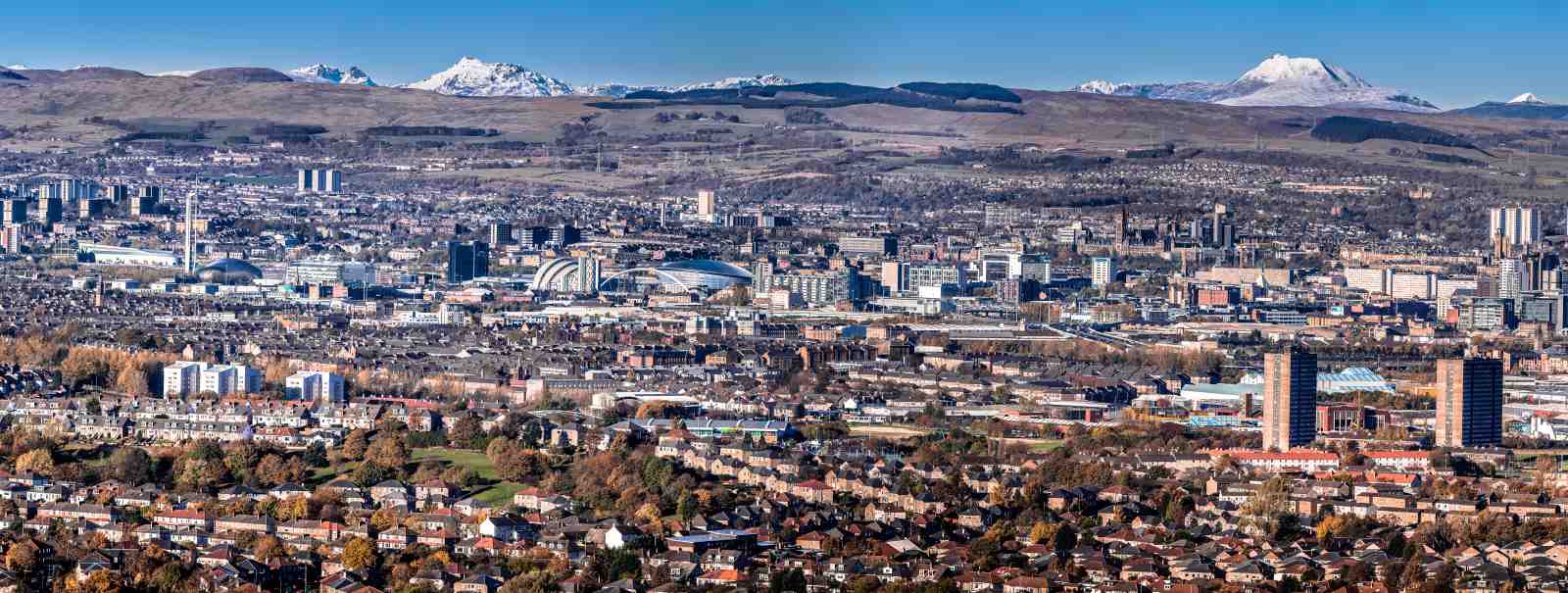 Panoramic Cityscape with Snow-Capped Mountains Wall Art