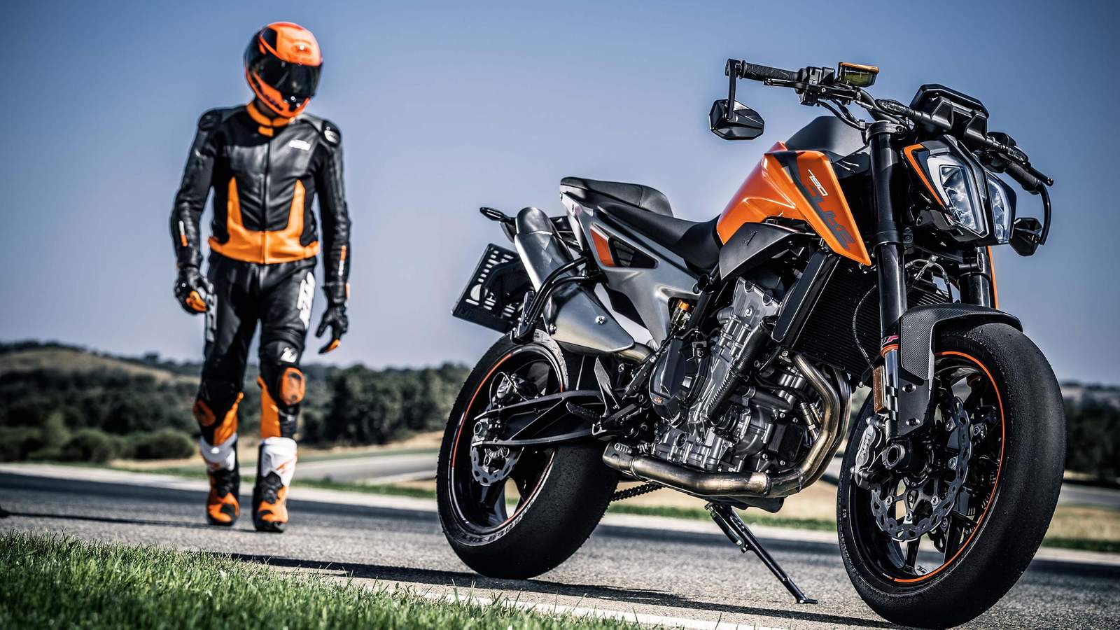 Dynamic Orange & Black Motorcycle Rider Wall Art