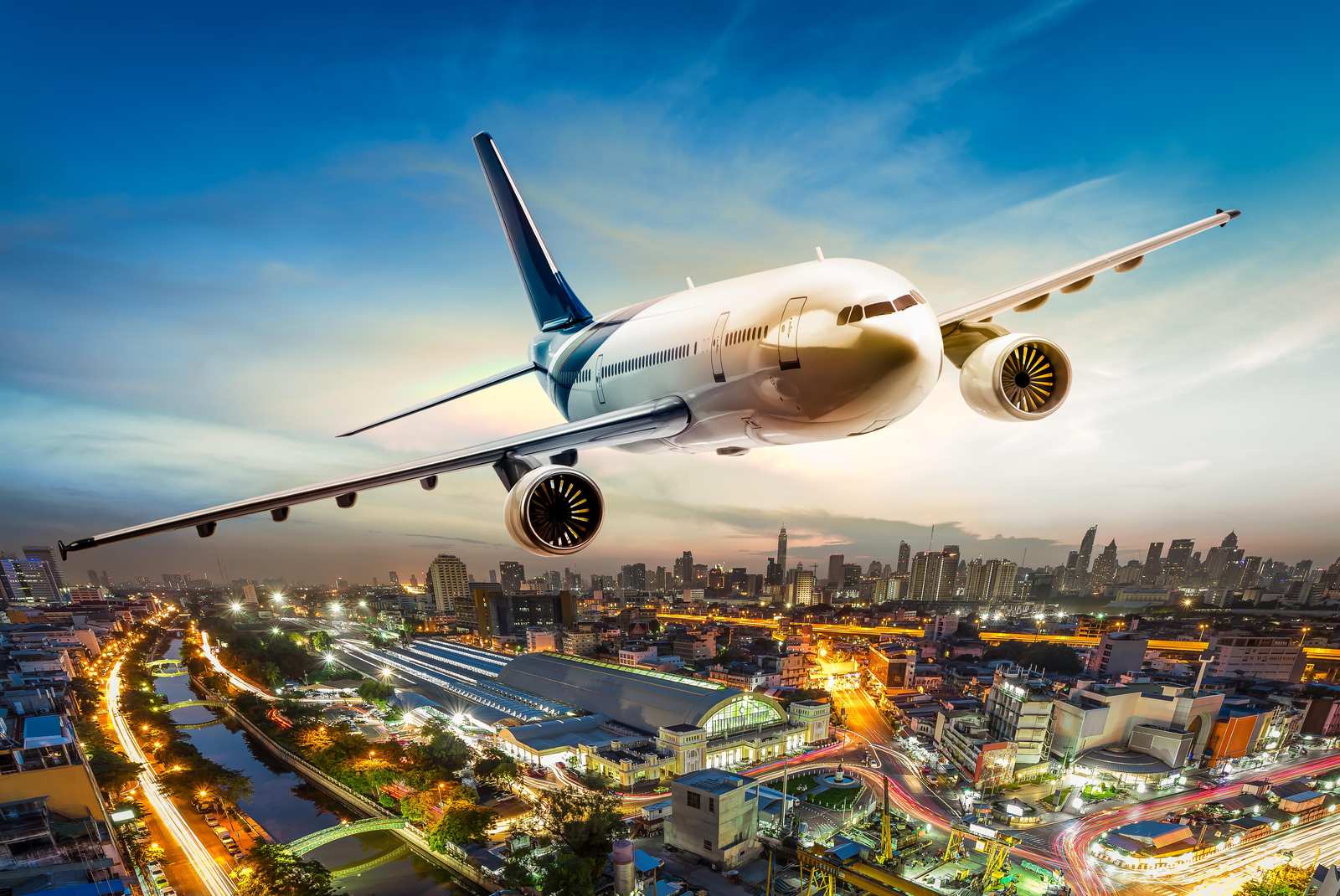 Airplane Over Cityscape Wall Art