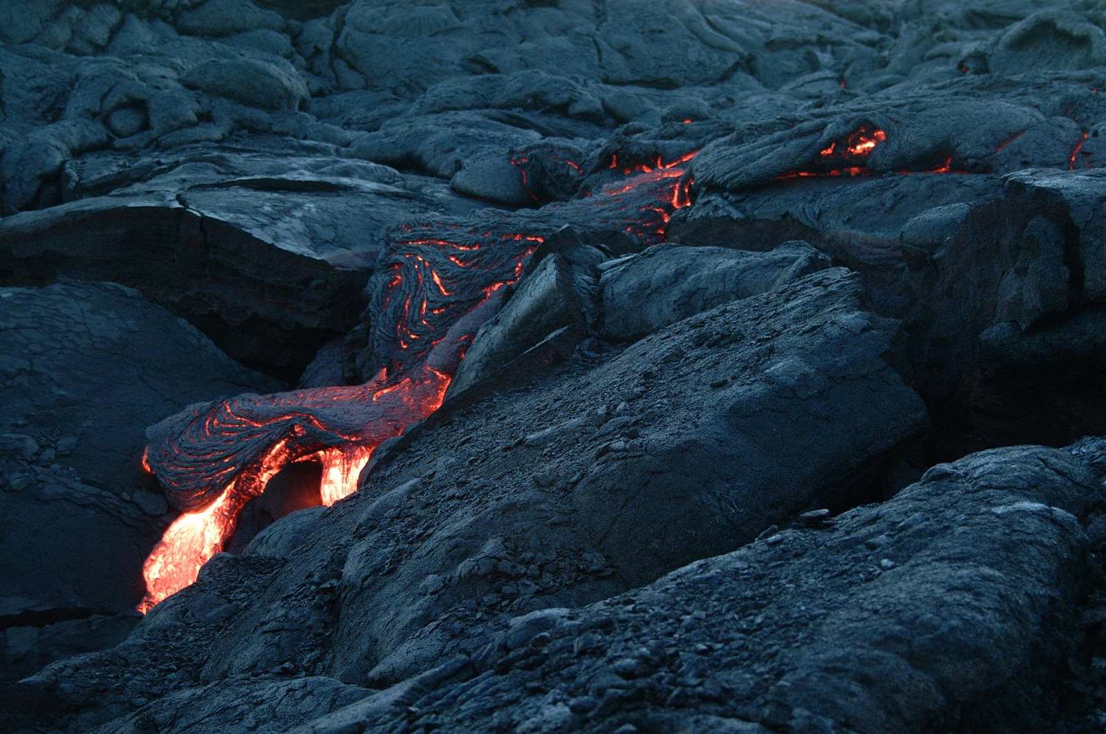 Fiery Lava Flow Over Dark Rock Wall Art