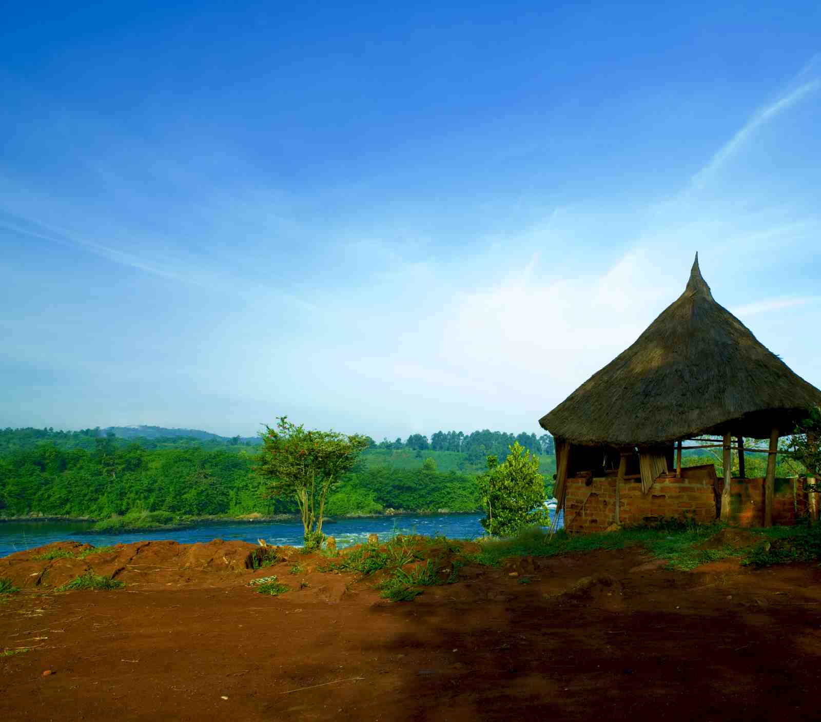 Serene Riverfront Hut Landscape Wall Art