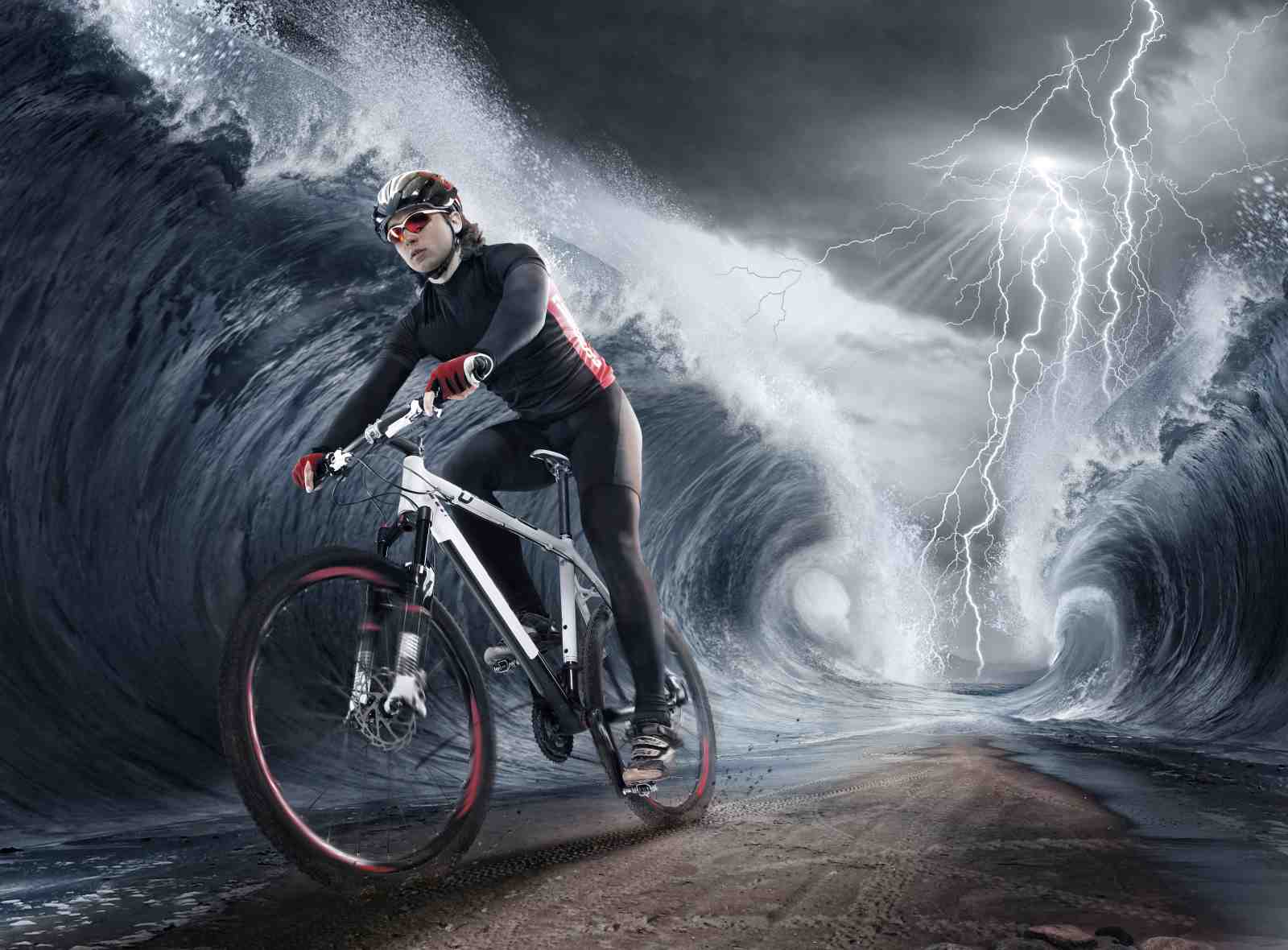 Extreme Cyclist Against Stormy Waves Wall Art