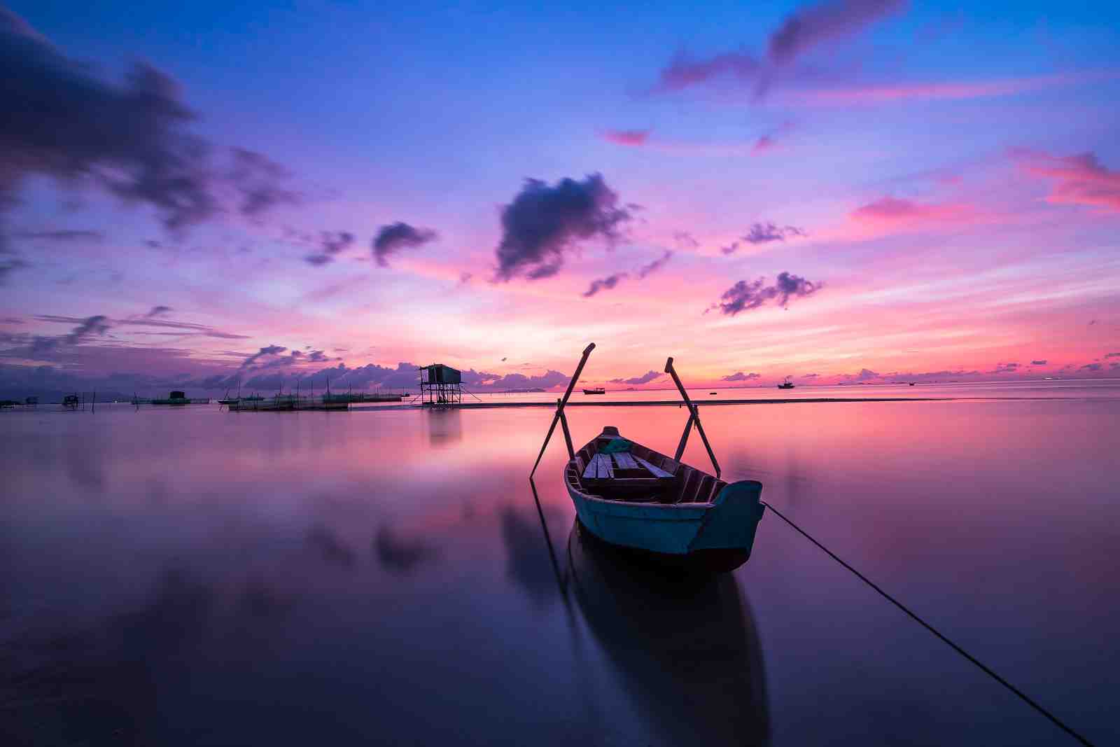 Serene Sunrise Boat Wall Art