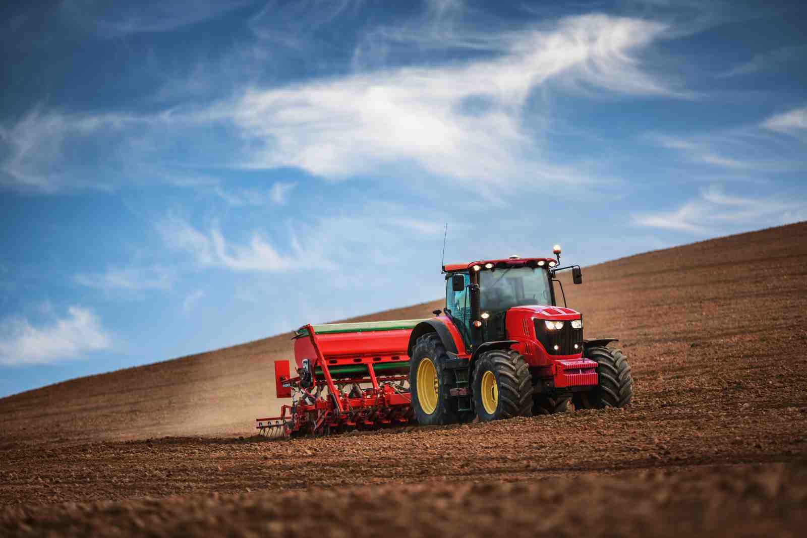 Red Tractor Tilling Field Wall Art