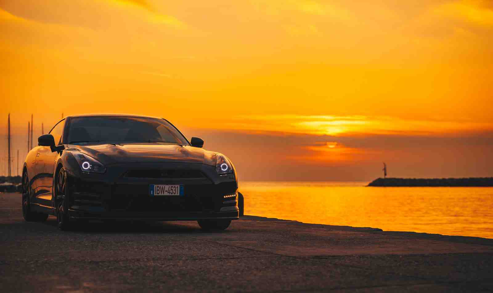Sleek Black GTR Sunset Ocean Wall Art