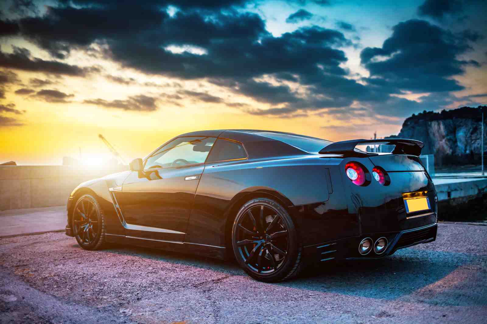 Sleek Black Sports Car Sunset Wall Art