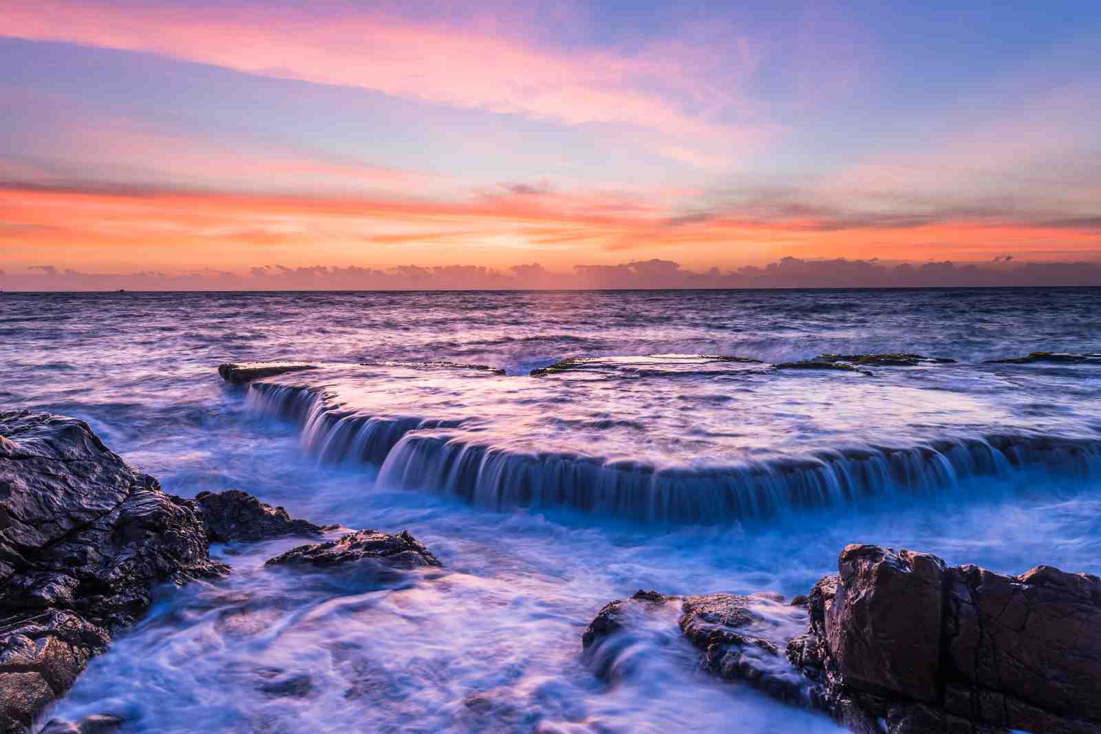 Serene Coastal Sunset Waterfall Wall Art
