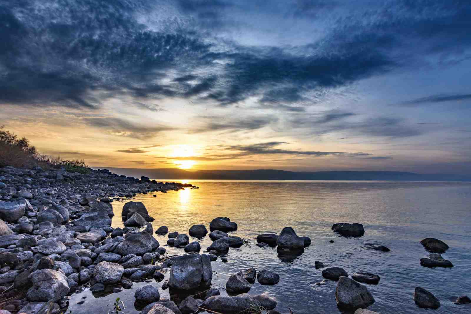Serene Sunset Lakeside Rocks Wall Art