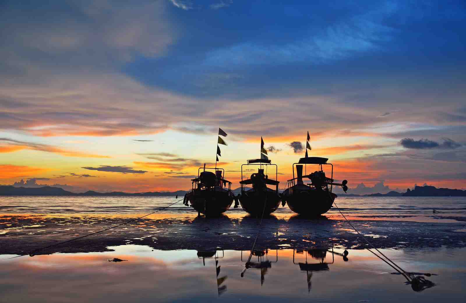 Serene Sunset Longtail Boats Wall Art