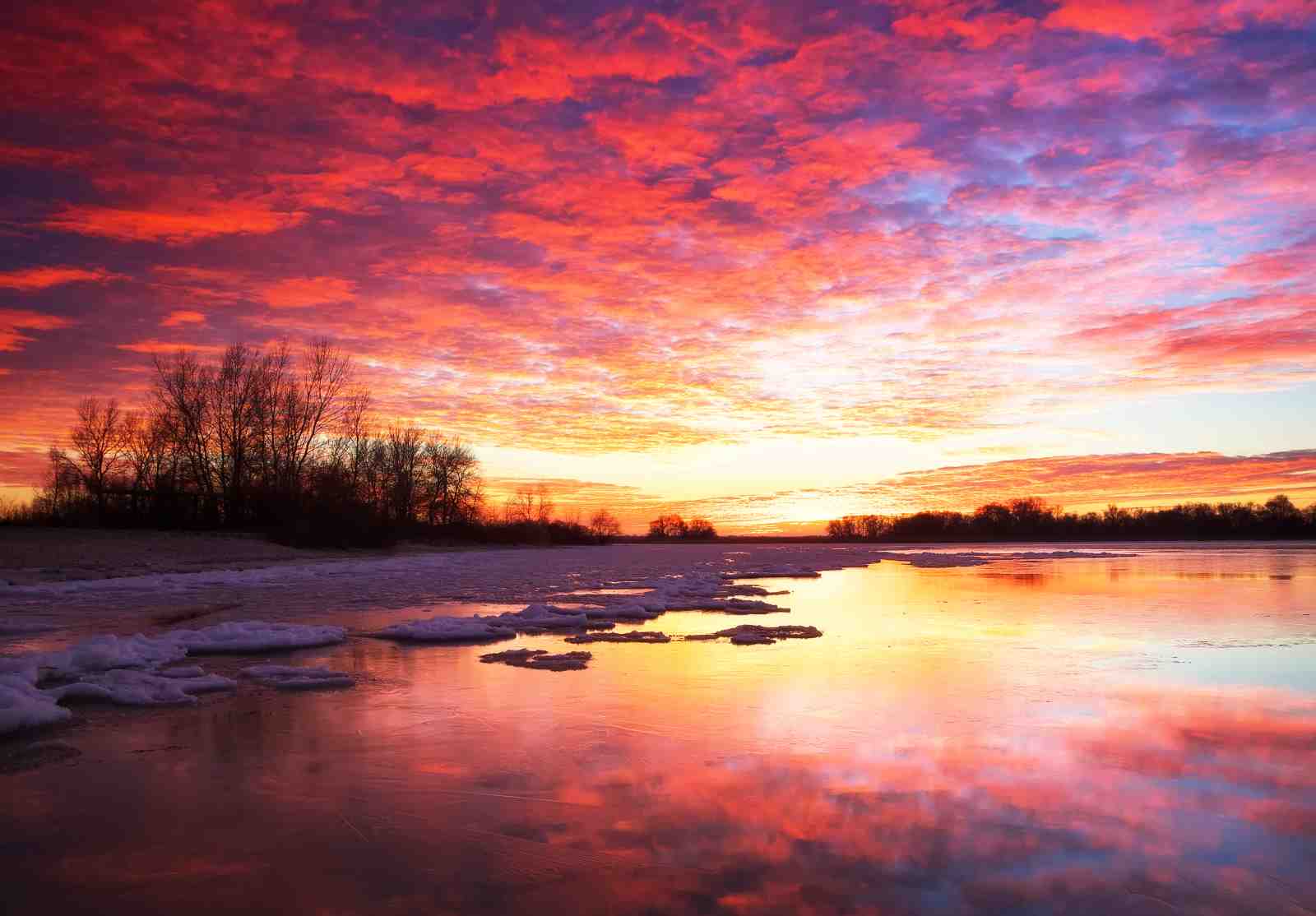 Vibrant Sunrise Over Icy River Wall Art
