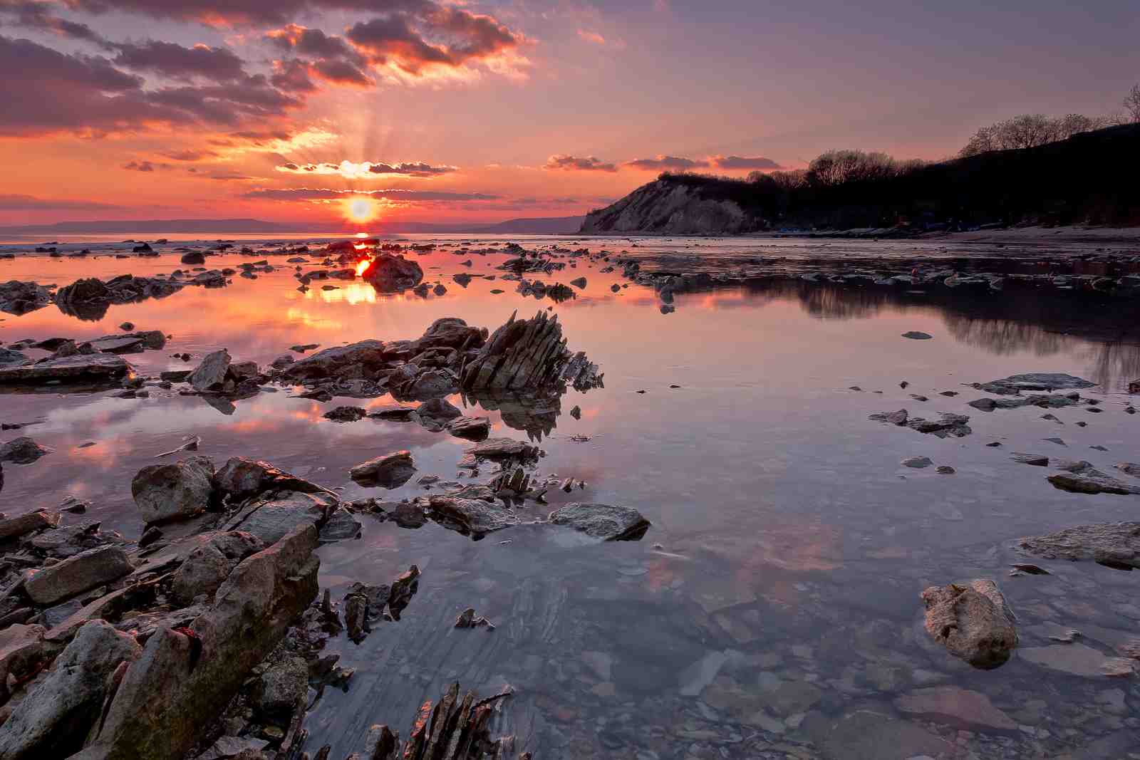Serene Sunset Rocky Shore Wall Art