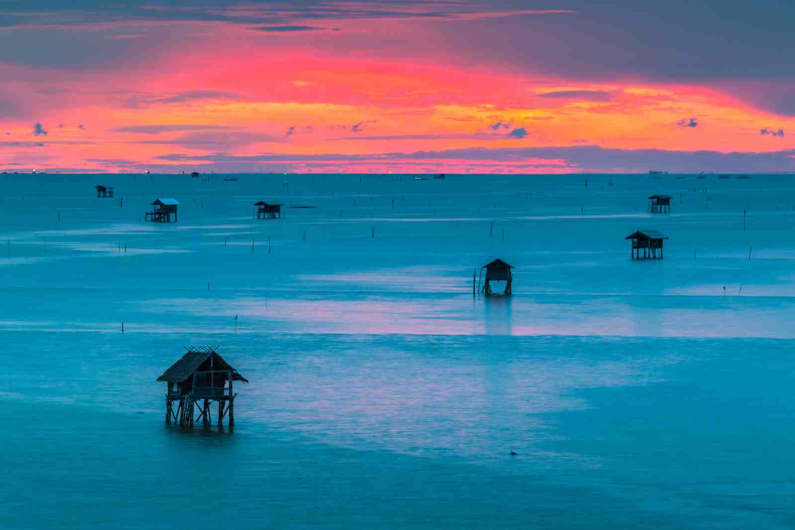 Serene Sunset Ocean Huts Wall Art