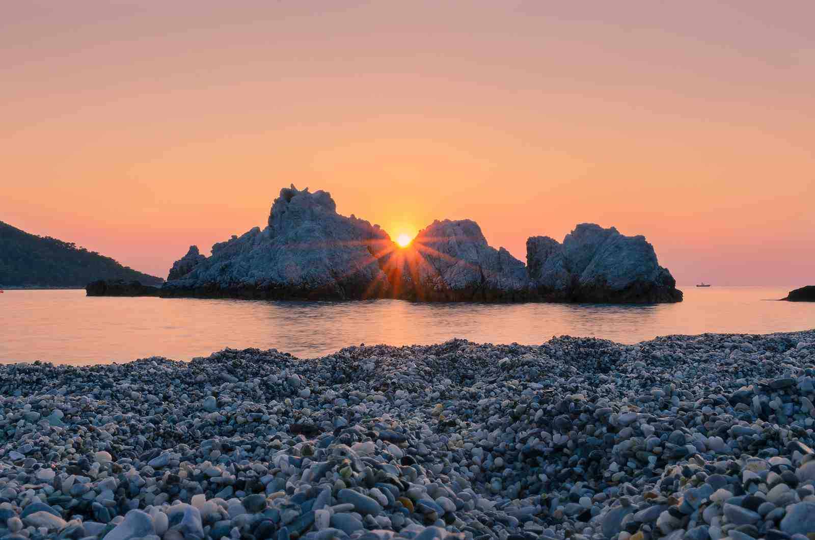Serene Sunset Beach Rocks Wall Art