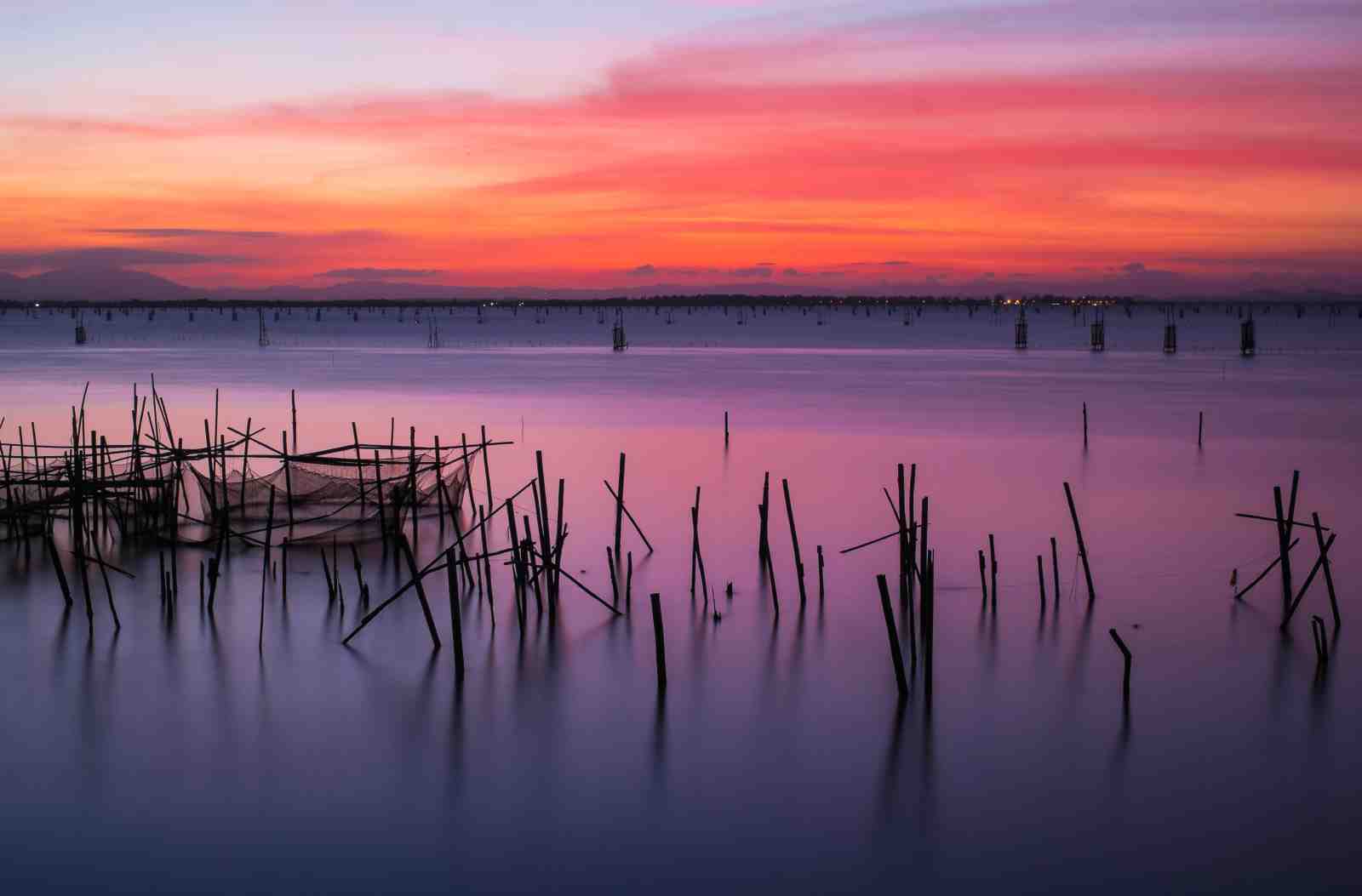 Serene Sunset Lake Fishing Nets Wall Art